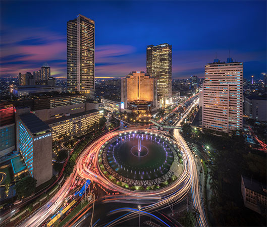 Aerial view of Jakarta city at night with sight of digital marketing agency Jakarta buildings