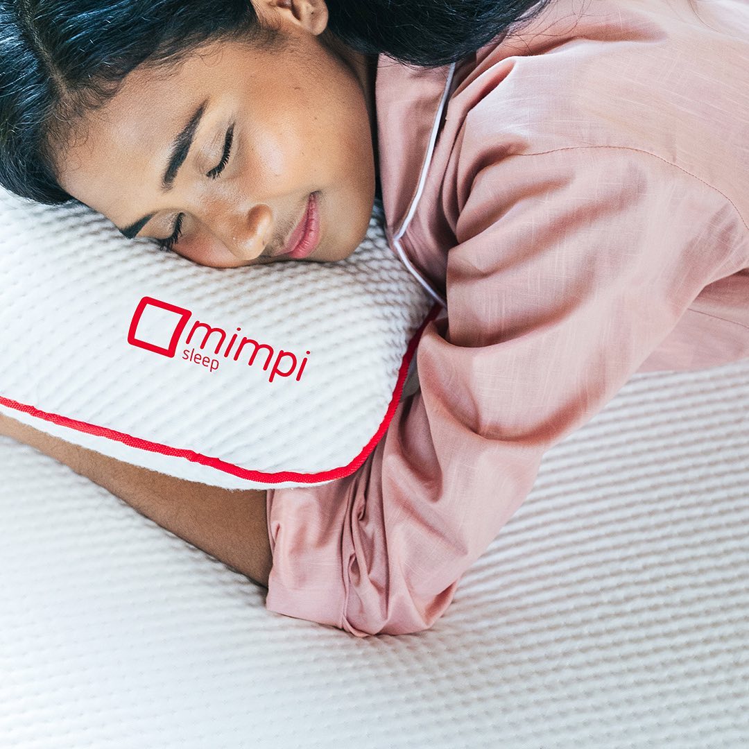 Woman sleeping with Mimpi Sleep pillow