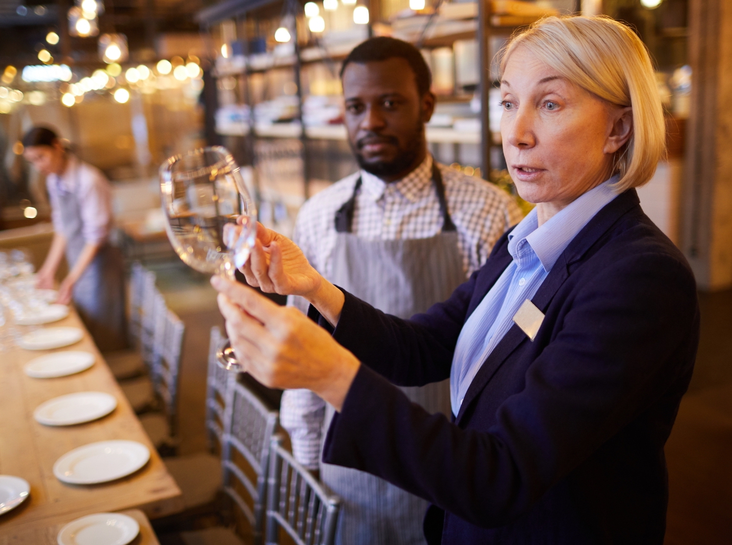 An old lady as head of restaurant complaints for the glass hygiene