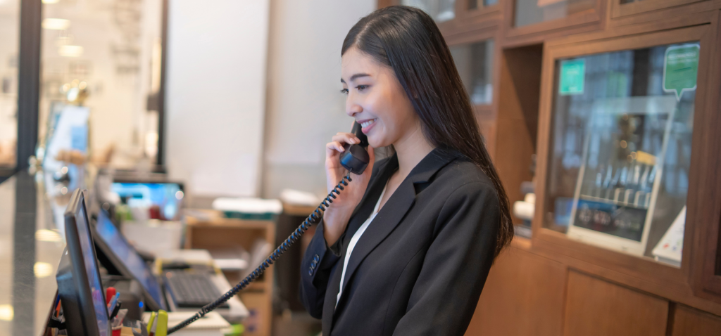 Front Desk Agent answering a phone call