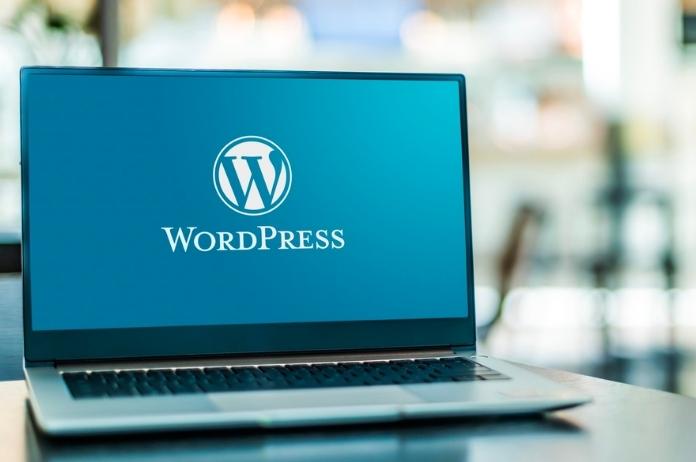 Black laptop displaying WordPress logo