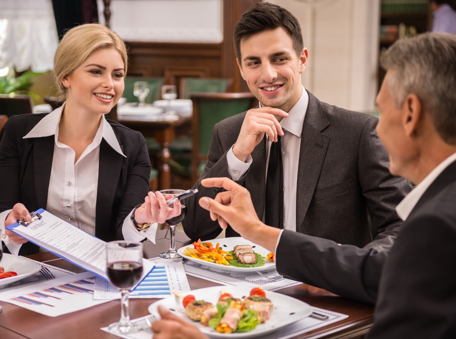 one-business-female-and-two-business-males-discuss-together-about-restaurant-business-plan