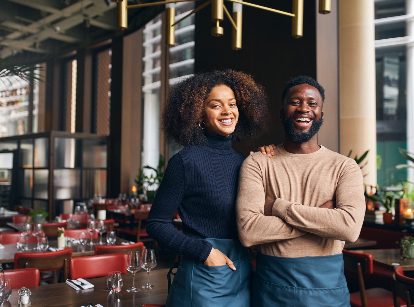 one-pretty-black-woman-and-one-handsome-man-standing-together-in-front-of-their-restaurant