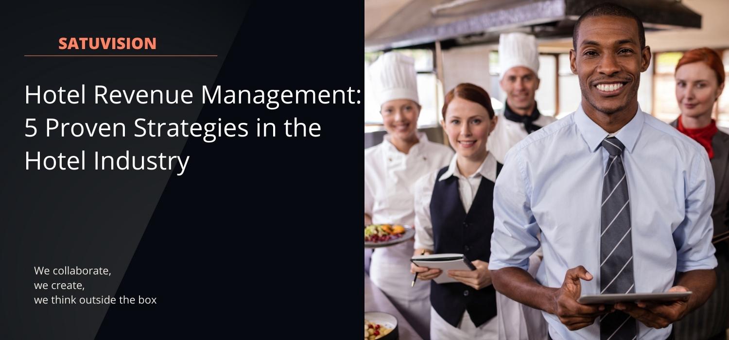 Hoteliers consisting of managers in charge of hotel revenue management, chefs, waiters, housekeepers, and others are taking pictures together in the kitchen smiling broadly and facing the camera.